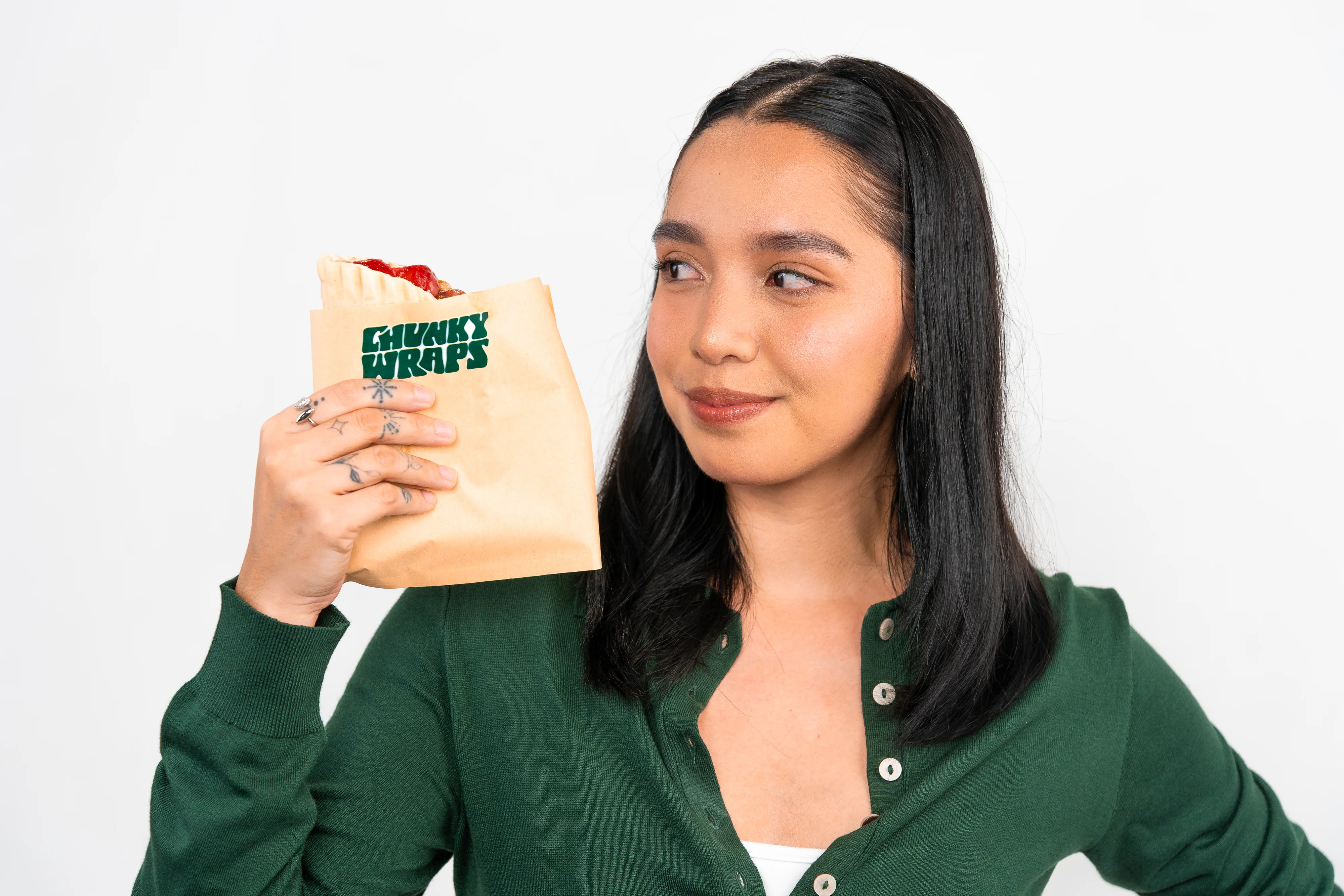 A customer holding a Chunky Wraps bag