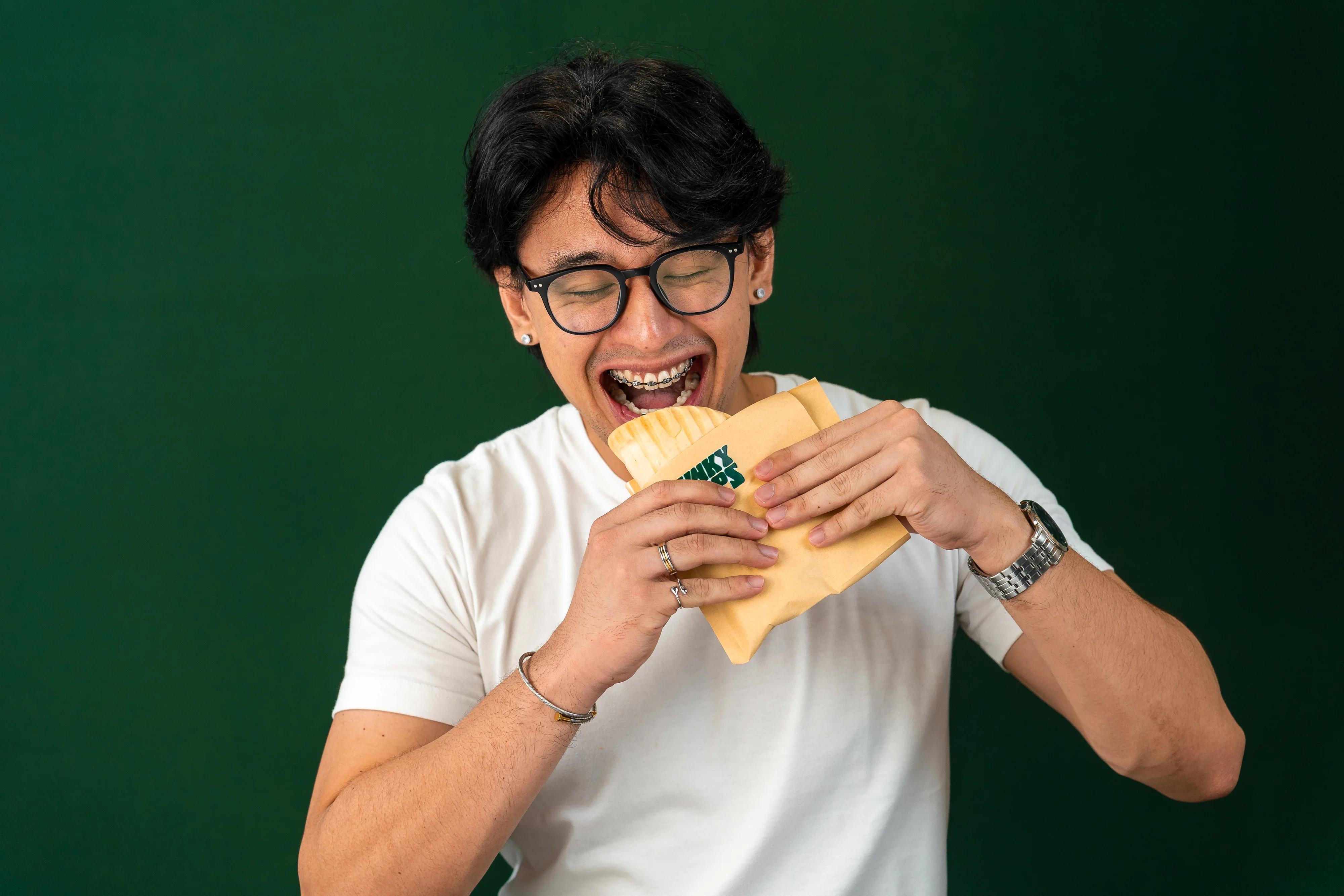 A customer enjoying a Chunky Wraps wrap